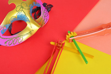Purim background with carnival mask and party costume