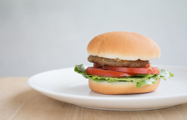 Closeup of Hamberger, It's junk food put on woodentable in food court