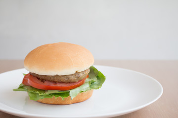 Closeup of Hamberger, It's junk food put on woodentable in food court