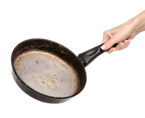 Old dirty fat pan in hand. Isolation on a white background.