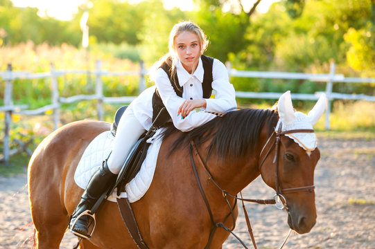 Girl equestrian rider riding a beautiful horse. Horse theme  