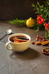 Mulled wine with spices and gifts on the table. Happy New Year! Top view