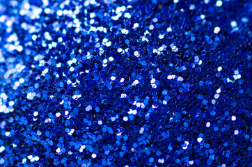Blue sparkles macro decoration Christmas on blur background
