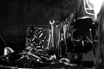 Different tipes of hand tools in car garage, close-up