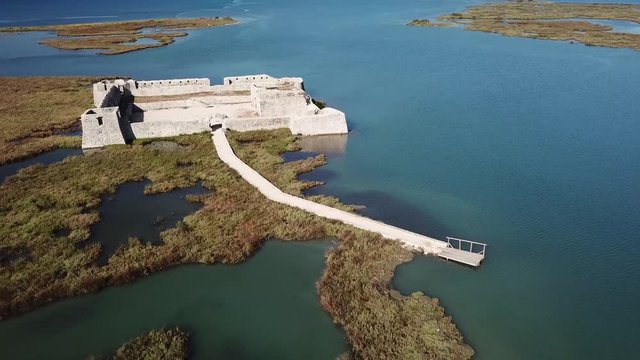Aerial view of Ali PAsha castle in Butrint, Albania near Saranda / Sarande (Albanian Riviera).  Beautiful historic Albanian castle surrounded by water lagoon
