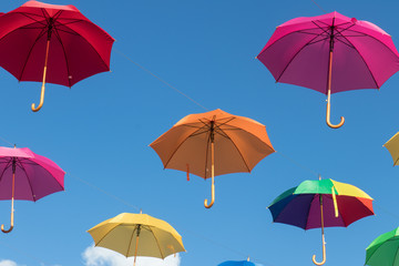 Fototapeta na wymiar multi color umbrellas floating in Werfenweng