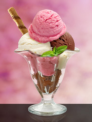 Vanilla, Strawberry and chocolate sundae ice cream cup and wafer isolated on white background