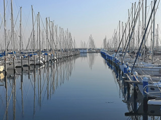 Italy, sailing boats in the Marina of Ravenna harbor. 