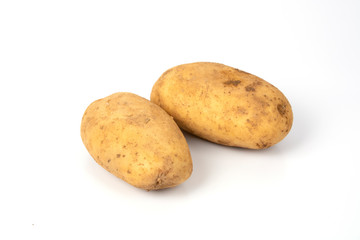 Raw potato over white background