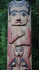 Fototapeta na wymiar Sitka, Alaska, USA: Totem of the Tsinglit nation on the grounds of the Sitka National Historic Park.