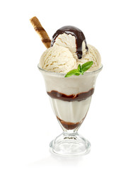 Vanilla and chocolate sundae ice cream cup with sauce and wafer isolated on white background