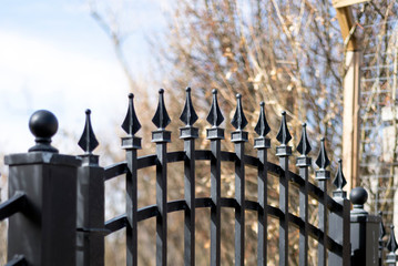 Black iron fence gate closeup