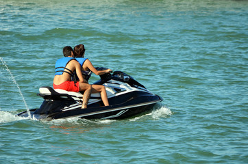 Couple Riding Tandem on a Jetski
