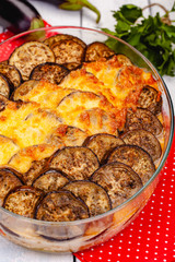 Greek Moussaka dish with minced meat, aubergine and sauce bechamel. Top view. Close up