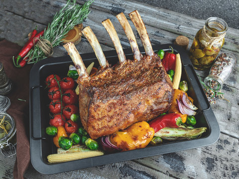 Grilled roasted rack of lamb,mutton with vegetables on the baking sheet