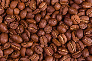 Background of many roasted coffee beans