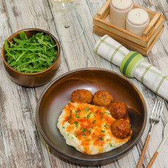 Fried meatballs with mashed potatoes and sauce. Fried turkey meatballs with puree