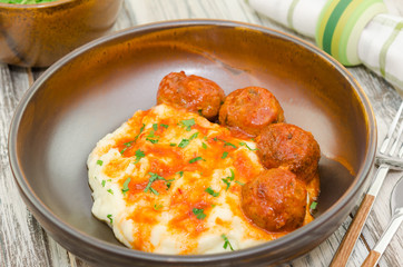 Fried meatballs with mashed potatoes and sauce. Fried turkey meatballs with puree