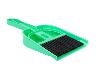 green dustpan scoop and brush isolated on the white