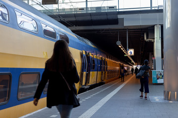 Train platform with an intercity train waiting to transport the people that arrive in a Dutch...