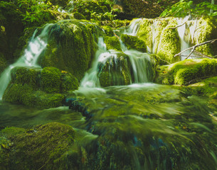 small waterfalls on green scenary
