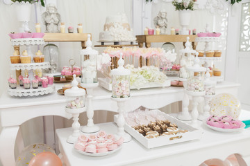 table with sweets decorated for children party reception