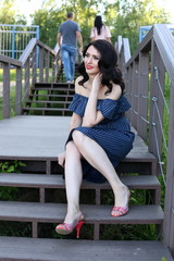 Outdoors portrait of beautiful woman on summer days