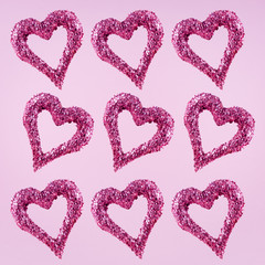 Glitter hearts on pink background.  Valentines day and love concept