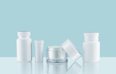 Cosmetic containers isolated on background