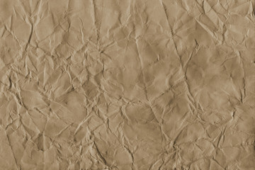 - Old coffee grunge paper texture. Vintage background for design and scrapbooking. Old, compressed and crumpled effect.