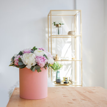 Flower Delivery To The Office. Working Space, Table With Notebooks And Magazines. A Luxurious Bouquet Of Peonies