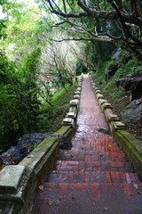 Ancient brick and stone walkway on Mount Phousi in Luang Prabang, Laos