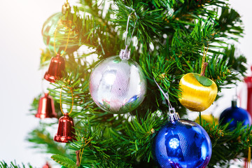 christmas tree with colorful balls and gift boxes isolated on white background