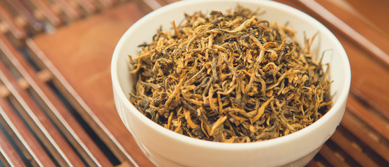 Chinese tea ceremony, Puer  in assortment closeup, Piala with chinese natural tea raw materials on a bamboo table
