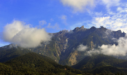 Mount Kinabalu during blue sky with cloud formation 