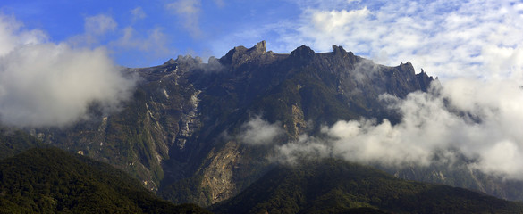 Mount Kinabalu during blue sky with cloud formation 