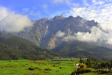 Mount Kinabalu during blue sky with cloud formation 