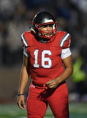 Football Quarterback making plays during a football game