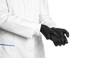 Fototapeta premium Doctor wearing medical gloves on white background