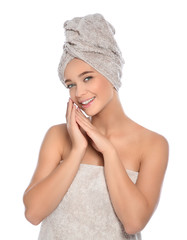 Portrait of young pretty woman with towels on white background