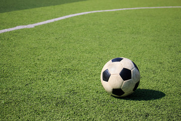 Football on artificial turf. It is for green background in a stadium