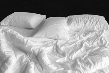 messy bed sheet and pillows