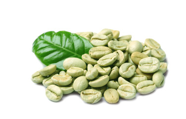 Green coffee beans and fresh leaf on white background