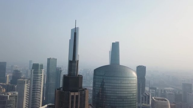 Guangzhou, China. Aerial shot of city downtown Central Buildings District area, with Central Park, canton Tower and pearl river on a sunny day in the afternoon