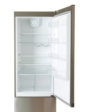 Modern refrigerator with open door on white background