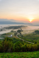 Fototapeta na wymiar sunrise with mist at the mountain