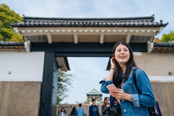 girl standing the entrance of osaka castle