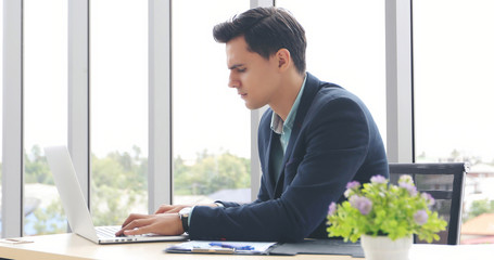 businessmen using notebook and fill serious about the work done until the headache