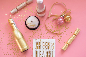 Pink and gold champagne flat lay - NYE background