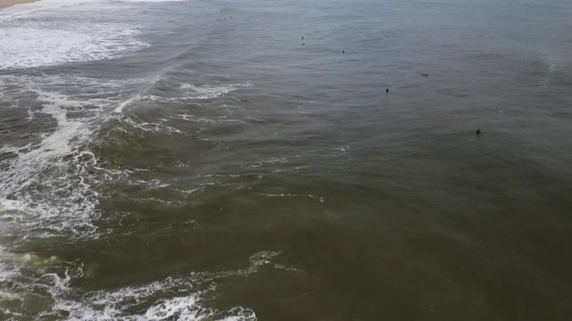 A lot of surfers are waiting for the next huge wave.